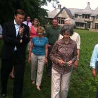 <p>U.S. Sen. Chris Murphy, at left, speaking with local residents and officials in Riverside Tuesday.</p>