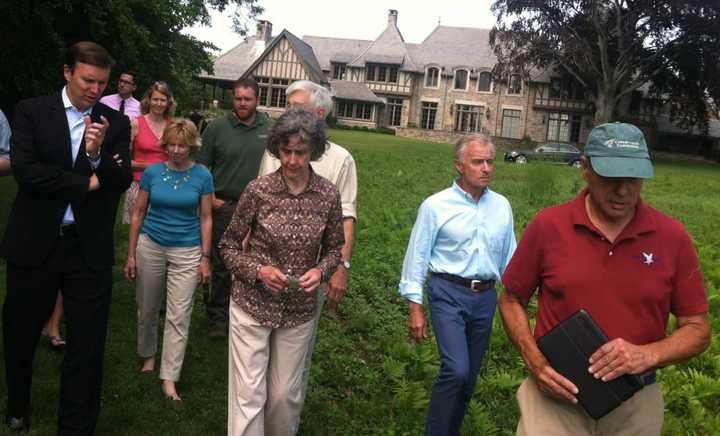 U.S. Sen. Chris Murphy, at left, speaking with local residents and officials in Riverside Tuesday.