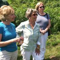 <p>U.S. Sen. Chris Murphy, at right, speaking with local residents and officials in Riverside Tuesday.</p>