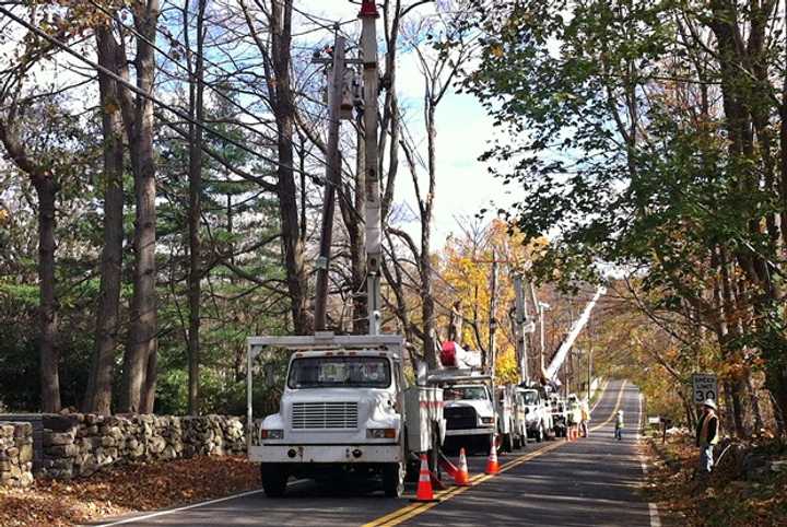 Power crews from all over the country are coming to help the towns, these crews in Ridgefield worked to restore power to one of the main lines on Branchville Road.