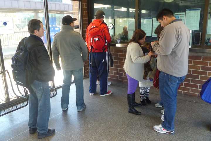 People wait in line at the Metro-North train station in White Plains. Parsons Brinckerhoff is being hired for $794, 214 by the City of White Plains to plan and design a new Multimodal Transportation Center near the train station and bus terminals. 