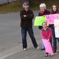 <p>The &quot;Wolfe Pack&quot; waits for Carolyn Wolfe to finish her 26.2 mile run Saturday in Danbury.</p>