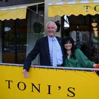 <p>Toni Sapienza, chef and owner of Tonis Tuscan Table, celebrates the opening of her downtown location with Mayor Bill Finch. </p>