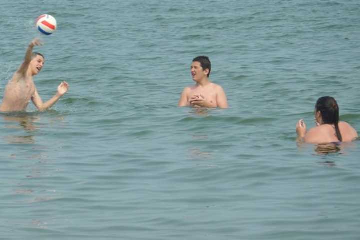 Swimmers frolic in the water of Long Island Sound. To stay safe in the water, and on the hiking trail, follow simple rules offered by Connecticut&#x27;s Department of Energy and Environmental Protection (DEEP).