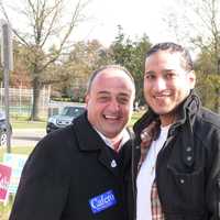 <p>State Rep. Larry Cafero (R-142), right, greets Norwalk voter Patrick Ashman at the Fox Run polling site Tuesday. </p>