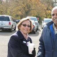 <p>Joanne Duff, mother of State Sen. Bob Duff (R-25), greets Ak Habib at the Fox Run polling site Tuesday in Norwalk.</p>