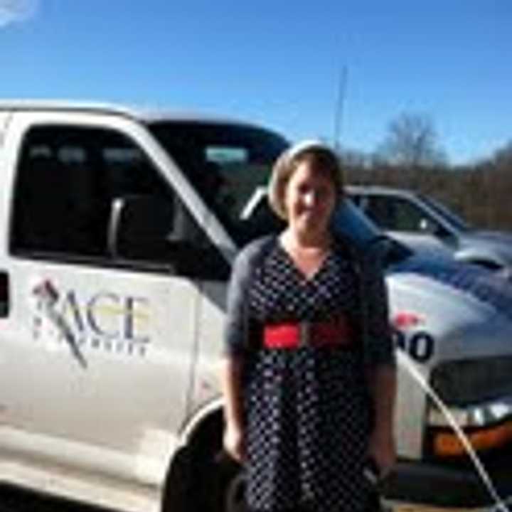 Pace University&#x27;s Caitlin Kelly and her Voter Van outside Briarcliff High School.