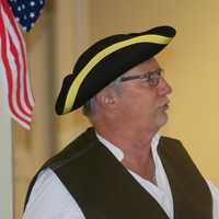 <p>Town Clerk Rick McQuaid reads a portion of the Declaration of Independence.</p>