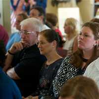 <p>Visitors listen intently at Saturday&#x27;s ceremony. </p>