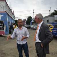 <p>Bridgeport Mayor Bill Finch (D) talks with business owner Rahman Hashimi  at the groundbreaking of Hashimi&#x27;s restaurant Monday afternoon.</p>