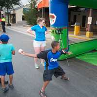 <p>A boy finds out how fast he can throw at the speed gun booth.</p>