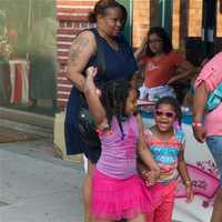 <p>Two young girls enjoy the music at the Atlantic League block party.</p>