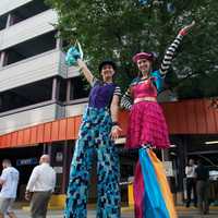 <p>Two girls on stilts greet visitors at Tuesday&#x27;s block party.</p>