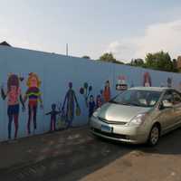 <p>A car heads past the construction site. </p>