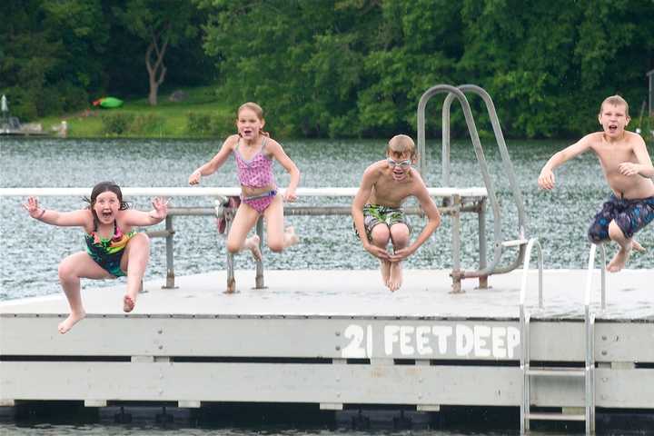 Showers Can't Spoil The Fun For Beach Lovers In Putnam