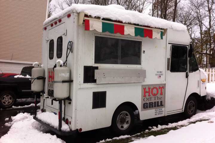 Norwalk Officer Pat English is donating use of his food truck, Hot Off The Grill, for Hurricane Sandy relief efforts in Queens. 