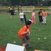 <p>Baseball Hall of Famer Cal Ripken, Jr. plays Quickball with kids on a new field in Bridgeport built by the Cal Ripken, Sr. Foundation.</p>