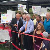 <p>Ripken and Bridgeport Mayor Bill Finch cut the ribbon on the new Youth Development Park at Florence E. Blackham School in Bridgeport.</p>