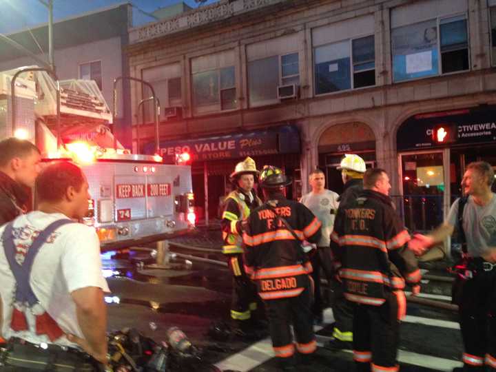 The fire, at a two-story building with a dollar store on the first floor and church on he second, was reported at around 2:45 a.m.