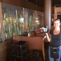 <p>Flipside Burgers and Bar Server Deborah Beutel gets &quot;Happy Hour&quot; ready with a tray of drinks.</p>