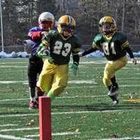 <p>Norwalk&#x27;s Nemo Harris turns the corner with help from Dean Tsiranides to score for the Packers.</p>