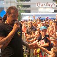 <p>Michael Franti thrills the crowd by getting up close and personal during Thursday night&#x27;s show.</p>