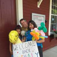 <p>Midge Pappas and Charles Stuttig welcome their Fresh Air guest, Nathaly, on Saturday in Greenwich. </p>