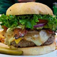 <p>The Big Boy Burger from Healy&#x27;s includes three cheeses, bacon, onions, lettuce, tomato, and homemde fries.</p>