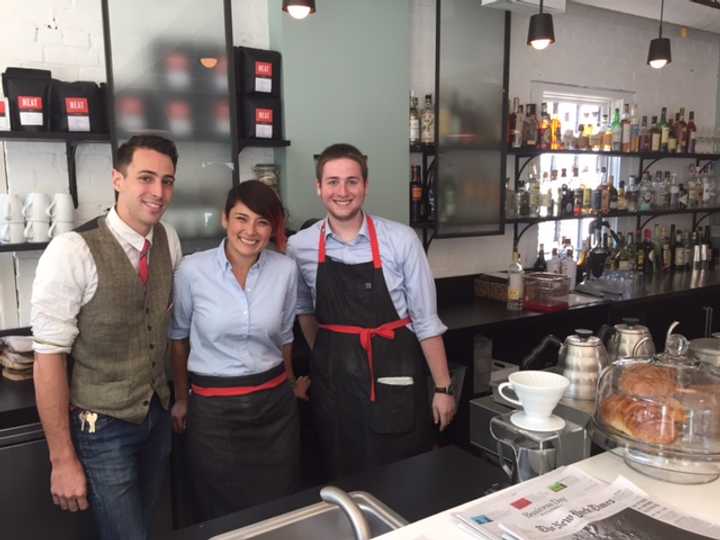 NEAT staff Trevor Rosetta, Sandra Walimaki and Nathan Francis pose for a picture at the bar Thursday.