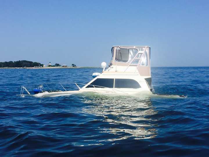 A fishing boat that hit rocks and sank sits on a reef off Green&#x27;s Ledge/Sheffield Island in the waters of Long Island Sound near Norwalk. 