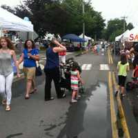 <p>People enjoyed walking on River Road during the sidewalk sale in Wilton.</p>