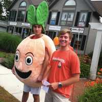 <p>Someone&#x27;s gotta do it: On a warm, muggy morning these two young men are promoting Peachwave frozen yogurt.</p>