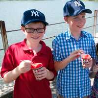 <p>From left: Gabriel, Thomas and Megan Sargent, of Westport, enjoy an Italian ice on a scorching hot day in Westport. </p>