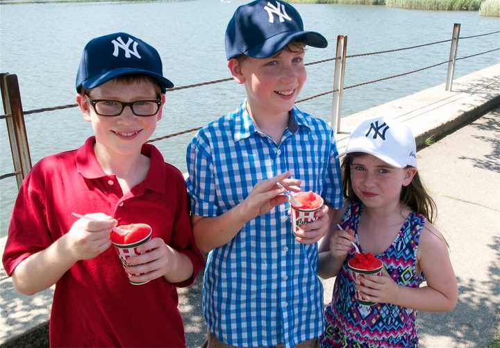 From left: Gabriel, Thomas and Megan Sargent, of Westport, enjoy an Italian ice on a scorching hot day in Westport. 