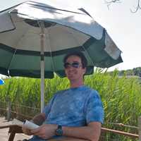 <p>Keeping cool under an umbrella in Westport.</p>