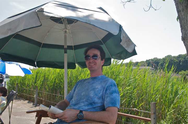 Keeping cool under an umbrella in Westport.