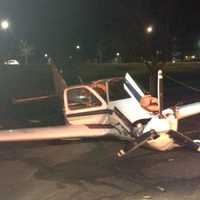 <p>A small plane that crash-landed early Saturday sits in a parking lot off King Street near Westchester County Airport.</p>