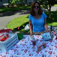 <p>A vendor shows off her wares at the Ridgefield Farmers Market, </p>