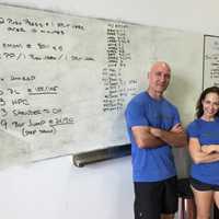 <p>CrossFit Westport Owner Amy Mandelbaum and General Manager Tim Deenihan pose for a picture at their recently opened gym Tuesday.</p>