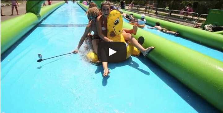 Slide the city, a 1,000-foot-long water slide will be in Stamford on Sunday.