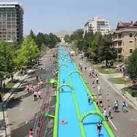 <p>Slide the city, a 1,000-foot-long water slide will be in Stamford on Sunday.</p>