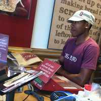 <p>COBS Bread bakery associate helping a customer.</p>