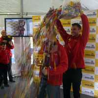 <p>Jeremiah Boehr, Master Model Builder in Kansas City and judge of the Westchester competition, dumps a bucket of LEGOs on the head of Michael Tocidlowski after he was named master model builder of the Yonkers store Sunday at Ridge Hill. </p>