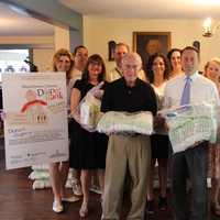 <p>County Executive Robert P. Astorino, the JLCW and local State Farm agents packaged diapers for the Westchester County Diaper Bank.</p>