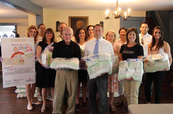 County Executive Robert P. Astorino, the JLCW and local State Farm agents packaged diapers for the Westchester County Diaper Bank.