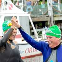 <p>Swimmers celebrate at the finish last year.</p>