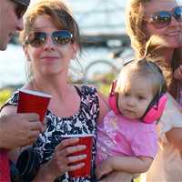 <p>Twin girls Emma and Morgan Cafaro make sure their ears are protected at Wednesday night&#x27;s show. </p>