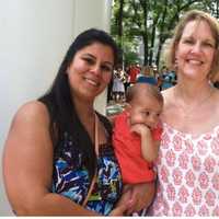 <p>Laila Bravo holds her 7-month-old daughter while standing beside Kim Petrone, right, of Malta House in Norwalk.</p>