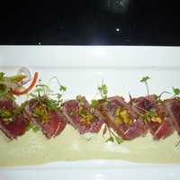 <p>Blackened tuna tataki  seared blackened tuna in a spicy aioli sauce  is one of the cold appetizers offered at Pink Sumo Sushi &amp; Sake Cafe in Westport.</p>