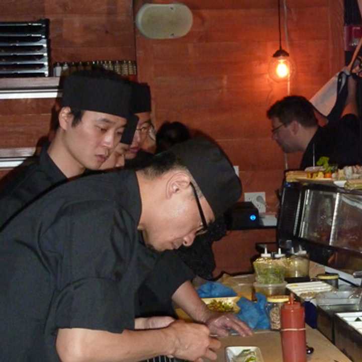 Eric Cheng, head chef at Pink Sumo Sushi &amp; Sake Cafe in Westport, prepares a dish Tuesday afternoon. 